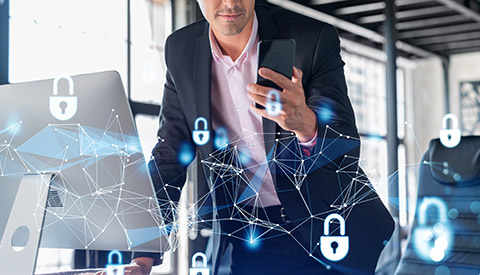 man holding a cellphone providing Ransomware Recovery in Abington, PA