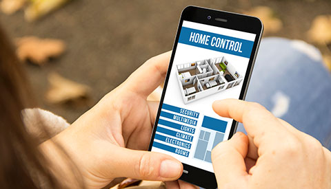 controlling smart home settings on an app for Home Automation, Smart Lighting, Home Theater Setup, Low Voltage Electrician, and Smart Home Systems for New Hope, PA
